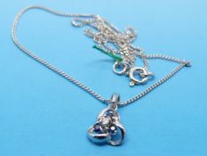 A 9ct white gold pendant set with sapphire and diamonds on a 9ct white gold chain