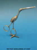 A pair of Georgian hallmarked silver umbilical cord or ribbon tweezers in the form of a stork,
