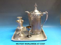A collection of plated ware including a large decorative jug with pierced finial (height 34cm).