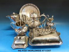 A three-piece silver plated tea set with wrythen foliate design, an Art Deco entree dish,
