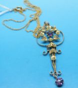 A 9ct gold Edwardian pendant set with amethyst and seed pearls on a 9ct gold chain