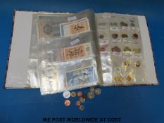 A folder containing an amateur collection  of world bank notes and coins