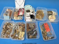 A collection of costume jewellery to include chains, brooches, cufflinks, earrings, necklaces,