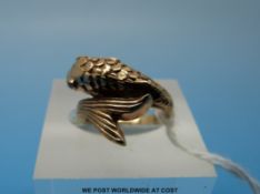 A yellow metal ring set in the form of a fish with ruby eyes (size D)