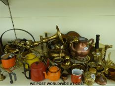 A large collection of brass and copper ware including jam pan,