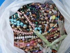 A collection of beaded necklaces to include a malachite example