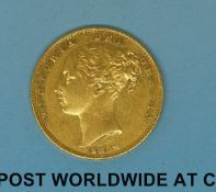 An 1852 young head gold full sovereign shield reverse