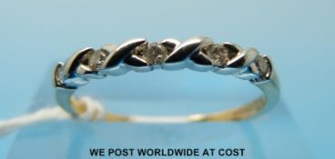 A 9ct gold ring set with five diamonds (size M/N)