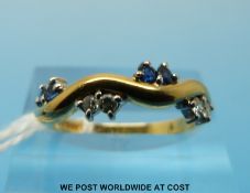 An 18ct gold ring set with diamonds and sapphires (size N)