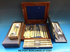 A quantity of boxed cutlery to include silver handled fish eaters,