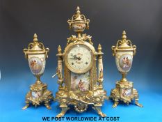 A French gilt metal and porcelain clock garniture