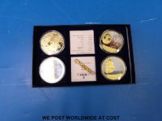 Four 250 year HMS Victory commemorative gold plated 50mm diameter coins in box with certificate