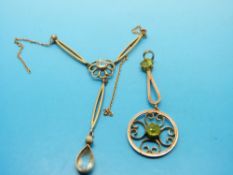 Two yellow metal pendants, one set with aquamarine,