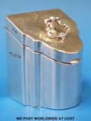 A George V hallmarked silver tea caddy formed as a miniature knife box,