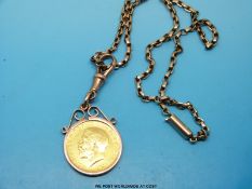 A 1911 gold full sovereign on a 9ct gold chain in a yellow metal mount marked 9ct (19.