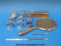 Six hallmarked silver napkin rings (111g),