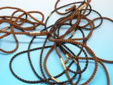 Three 19thC plaited hair lengths with white metal fittings