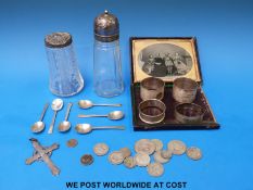 Four various hallmarked silver napkin rings and six hallmarked silver teaspoons, 121g,