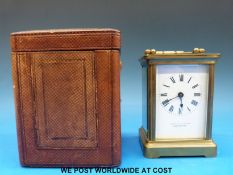 A French brass carriage clock in case,