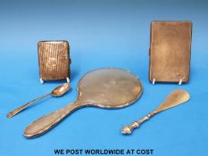 Two hallmarked silver silver cigarette cases and a hallmarked silver spoon (288g),