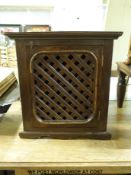 A hanging corner cupboard with lattice front (height 74cm width 68cm)