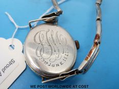 A 1920s silver gentleman's military style wristwatch with black face and subsidiary seconds dial on