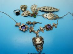 A silver filigree necklace set with amethysts and a cameo,  white metal brooch,