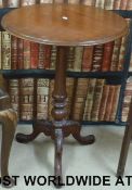 A 19thC tripod table with carved legs (H70 x 50cm diameter)