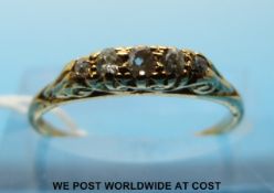 An 18ct gold ring set with five old cut diamonds (size L)