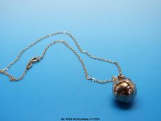 A 9ct gold Masonic charm/ pendant which folds out to reveal a cross and Masonic symbols,