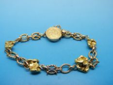A 9ct gold bracelet set with four gold nuggets,