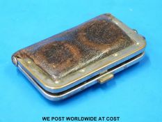 A leather sovereign purse with silver plate binding and clasp