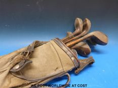 A set of vintage golf clubs including George Nicholl with bag