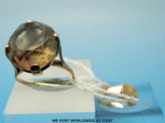 A 9ct gold ring set with a large smoky quartz together with a 9ct gold child's ring