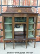 A late 19thC inlaid display cabinet with bow front central section with door to top and mirror back