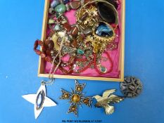 A collection of costume jewellery to include brooches by Sphinx, Exquisite, Trifari,