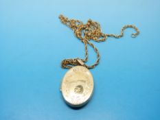 A 9ct gold chain and locket (7.