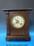 A Fattorini and Sons patent automatic alarm oak cased clock