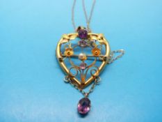 A 9ct gold hallmarked Edwardian pendant set with seed pearls and amethysts in a heart design