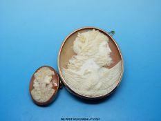 A cameo depicting a man with an eagle in a 9ct gold mount and a cameo of a lady also in 9ct gold