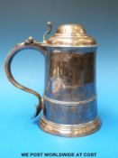 A George II dome-lidded silver tankard of plain tapering form with S scroll handle, Ldn 1752,