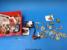 A collection of jewellery to include chains, brooches,