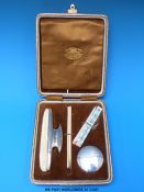 A cased Goldsmiths & Silversmiths Company hallmarked silver mounted manicure set
