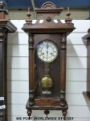 A pine-cased Vienna style wall clock