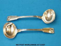 A pair of Victorian hallmarked silver Fiddle Thread and Shell pattern sauce ladles,