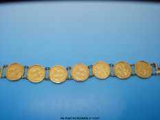 A bracelet made up of seven Victorian gold full sovereigns six being Melbourne Mint 1892,1891, 1892,