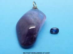 An amethyst pendant and a loose sapphire