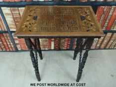 A late 19thC occasional table with geometric inlaid design flanked by floral designs,