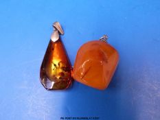 An irregular egg yolk colour amber bead made into a pendant (2.