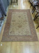 A beige and red wool rug (approximately 4' x 8')